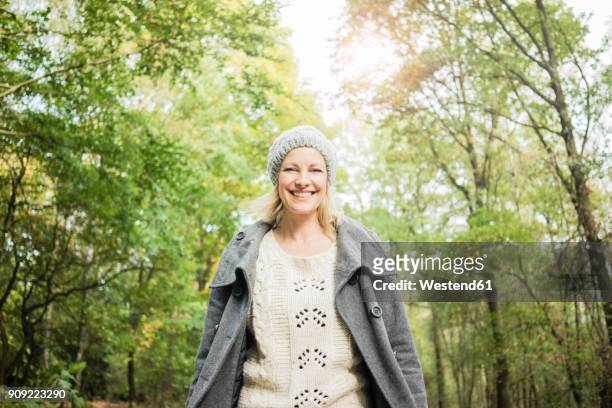 portrait of happy woman in the forest in autumn - forest walking front stock pictures, royalty-free photos & images
