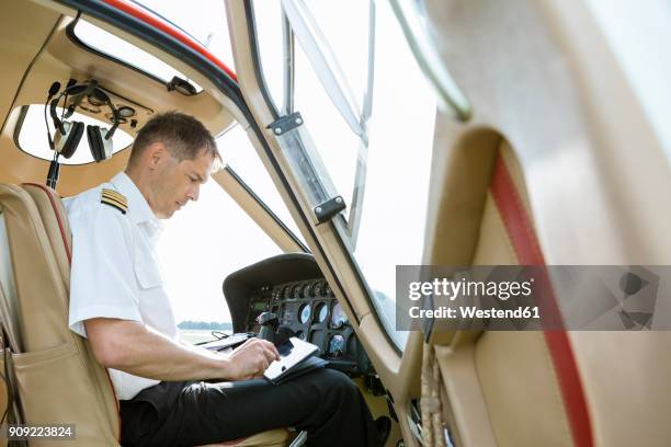 Pilot Using Computer 44 Pilot Cockpit Tablet Stock Photos, High-Res Pictures, and Images ...