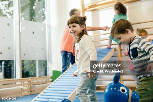 happy children in gym room in kindergarten - kid gymnastics stock pictures, royalty-free photos & images