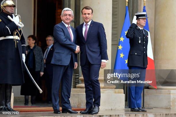 French President Emmanuel Macron welcomes Armenian President Serge Sarkissian at Elysee Palace on January 23, 2018 in Paris, France. During this work...