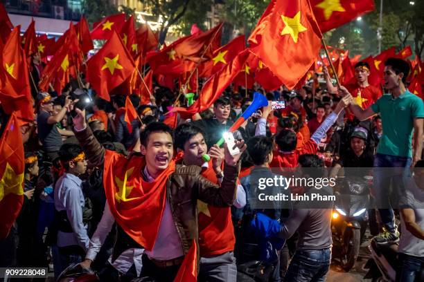 Thousands of Vietnamese football fans pour into the city center to celebrate Vietnam's national U23 football team historic win over Qatar in the...