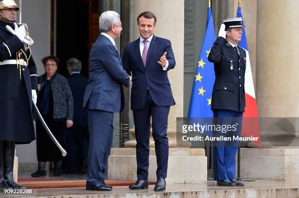French President Emmanuel Macron welcomes Armenian President Serge Sarkissian at Elysee Palace on January 23, 2018 in Paris, France. During this work...