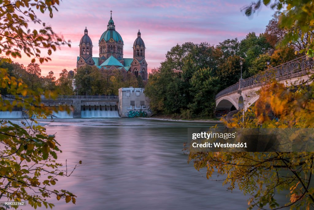 Germany, Bavaria, Munich, River Isar, Prater Island and St Luke's church in autumn