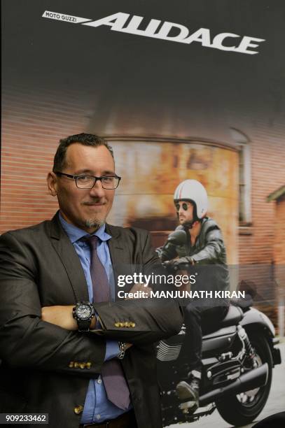 Managing Director and CEO of Italian automobile company Piaggio in India Diego Graffi looks on during a Piaggio store opening in the Indian city of...