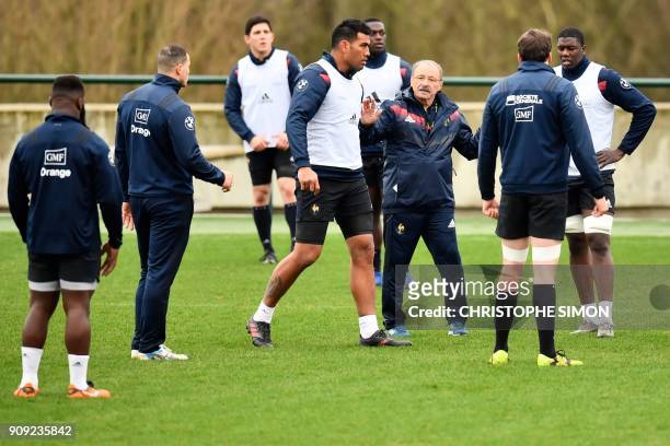 France rugby union national team coach Jacques Brunel speaks to his players during a training session on January 23, 2018 at the team's training camp...