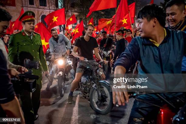 Thousands of Vietnamese football fans pour into the city center to celebrate Vietnam's national U23 football team historic win over Qatar in the...