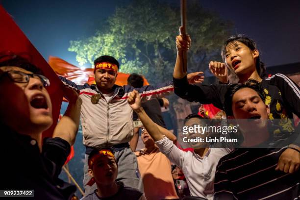 Thousands of Vietnamese football fans pour into the city center to celebrate Vietnam's national U23 football team historic win over Qatar in the...