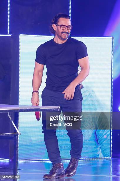 Bollywood actor Aamir Khan plays table tennis during 'Secret Superstar' press conference on January 23, 2018 in Beijing, China.