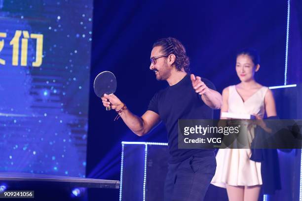 Bollywood actor Aamir Khan plays table tennis during 'Secret Superstar' press conference on January 23, 2018 in Beijing, China.