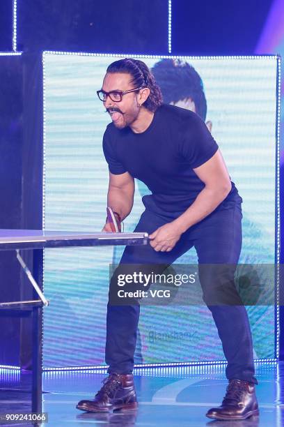 Bollywood actor Aamir Khan plays table tennis during 'Secret Superstar' press conference on January 23, 2018 in Beijing, China.