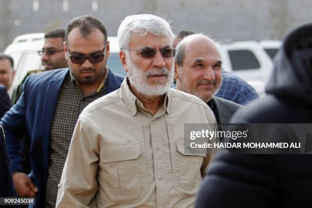 Abu Mahdi al-Mohandis, the number two of Iraq's Hashed al-Shaabi, known in English as the Popular Mobilisation Units, meets with officials during a...