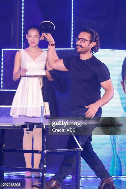 Bollywood actor Aamir Khan plays table tennis during 'Secret Superstar' press conference on January 23, 2018 in Beijing, China.