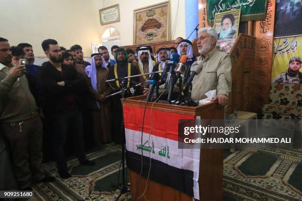 Abu Mahdi al-Mohandis, the number two of Iraq's Hashed al-Shaabi, known in English as the Popular Mobilisation Units, holds a press conference during...