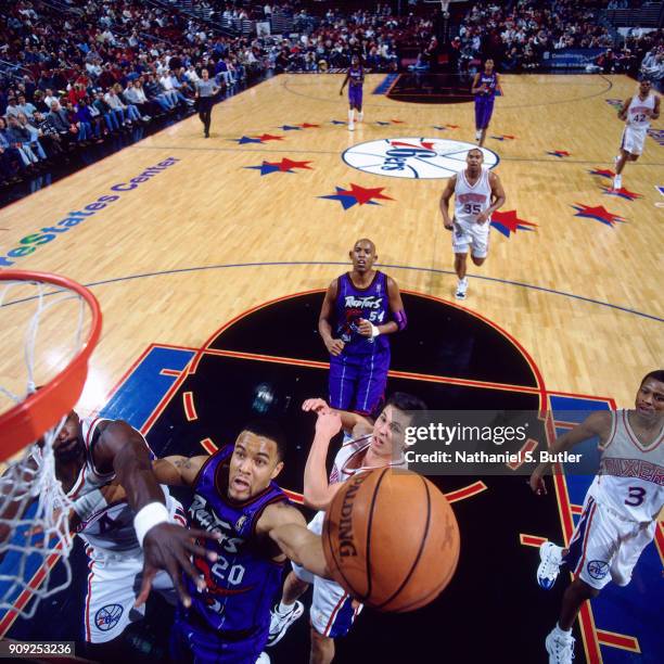 Damon Stoudamire of the Toronto Raptors shoots during a game played on January 29, 1997 at the First Union Arena in Philadelphia, Pennsylvania. NOTE...