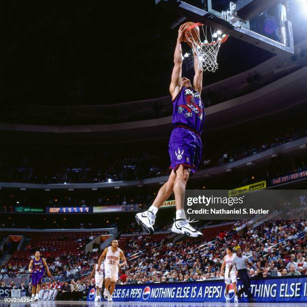 Doug Christie of the Toronto Raptors dunks during a game played on January 29, 1997 at the First Union Arena in Philadelphia, Pennsylvania. NOTE TO...