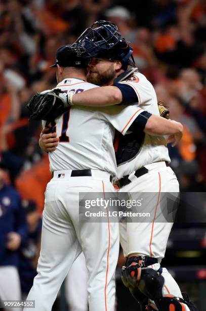 Brad Peacock and Brian McCann of the Houston Astros celebrate after the Astros defeated the Los Angeles Dodgers in Game 3 of the 2017 World Series at...