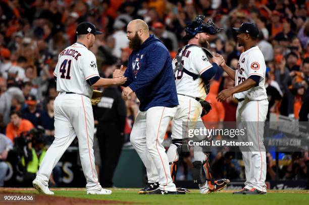 Brad Peacock, Evan Gattis, Brian McCann, and Tony Sipp, of the Houston Astros celebrate after the Astros defeated the Los Angeles Dodgers in Game 3...