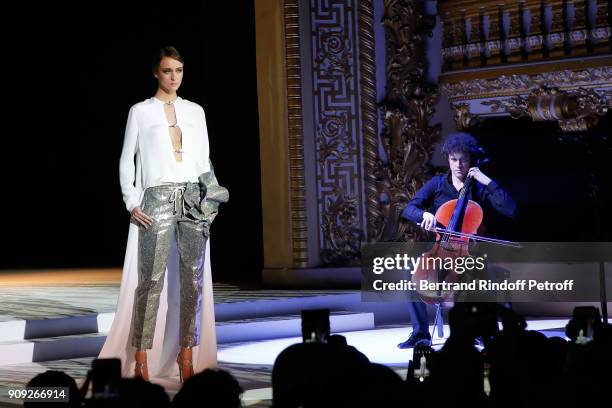 Violoncellist Francois Salque performs during the Stephane Rolland Haute Couture Spring Summer 2018 show as part of Paris Fashion Week. Held at Opera...