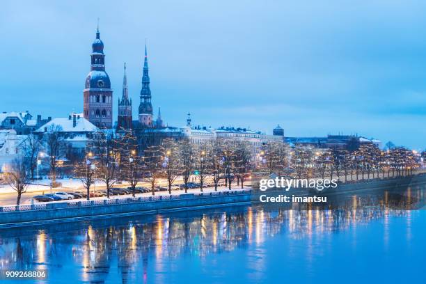 riga towers in winter - riga latvia stock pictures, royalty-free photos & images