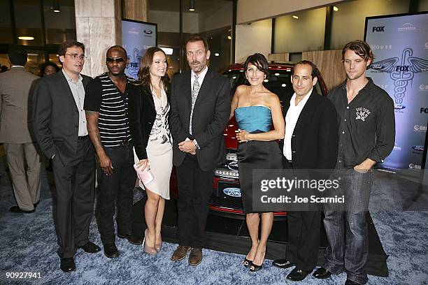 Actors Robert Sean Leonard, Omar Epps, Olivia Wilde, Hugh Laurie, Lisa Edelstein, Peter Jacobson, and Jesse Spencer stop for a photo at the "House"...