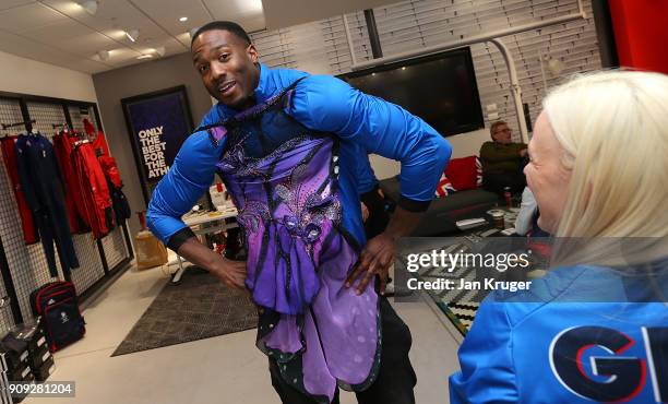 Toby Olubi jokes by trying on the uniform of Penny Coomes during the Team GB Kitting Out Ahead Of Pyeongchang 2018 Winter Olympic Games at Adidas...