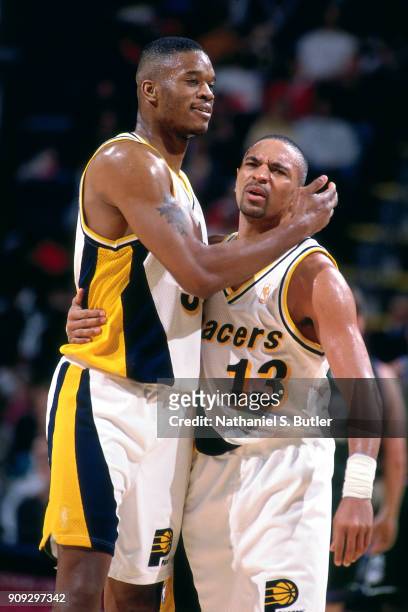 Mark Jackson and Antonio Davis of the Indiana Pacers react during a game played on February 28, 1997 at Market Square Arena in Indianapolis, Indiana....