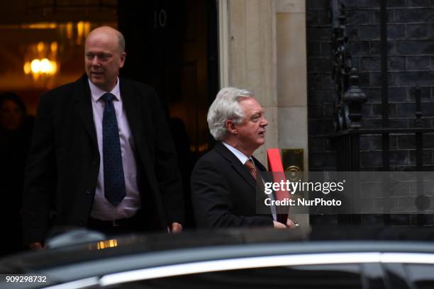 Britain's Transport Secretary Chris Grayling and Britain's Secretary of State for Exiting the European Union David Davis leave after attending the...