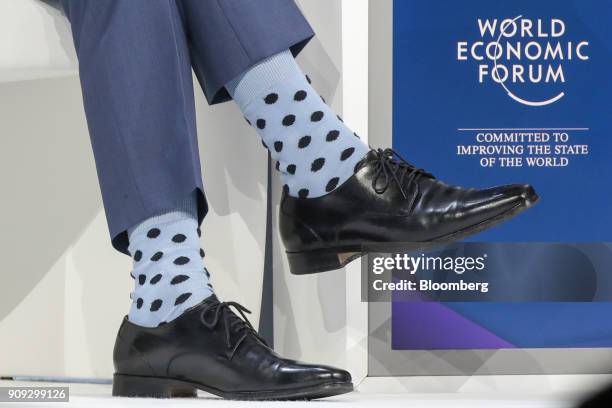 Justin Trudeau, Canada's prime minister, wears spotted socks while speaking during a special session on the opening day of the World Economic Forum...