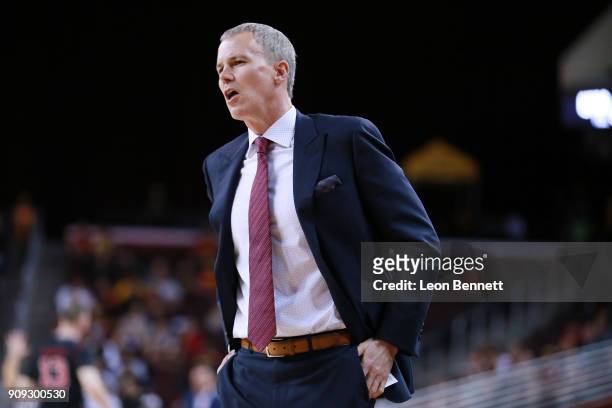 Andy Enfield Head coach of the USC Trojans looks on while directing his team against the Utah Utes during a PAC12 college basketball game at Galen...