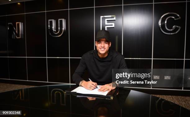 Kenedy signs his contract at St.James' Park on January 23 in Newcastle, England.