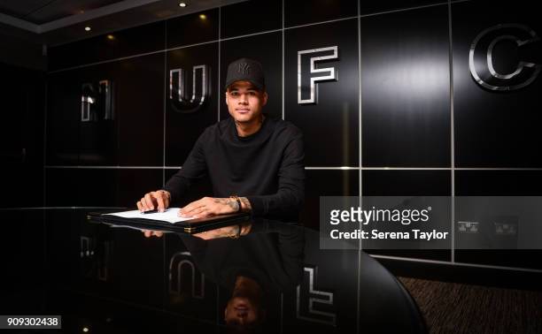 Kenedy signs his contract at St.James' Park on January 23 in Newcastle, England.