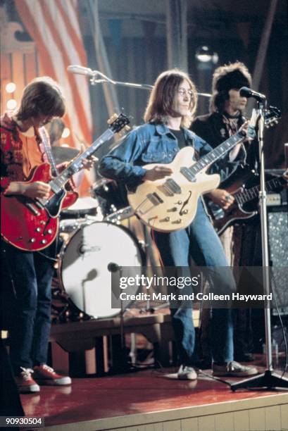 John Lennon plays 'Yer Blues' at the Rock 'n' Roll Circus, Wembley, London, with Keith Richards on bass and Eric Clapton on guitar, December 1968.