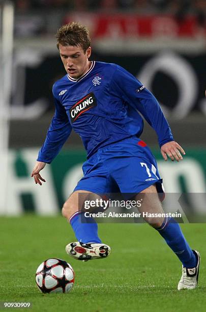 Steven Davis of Glasgow runs with the ball during the UEFA Champions League Group G match between VfB Stuttgart and Rangers FC on September 16, 2009...