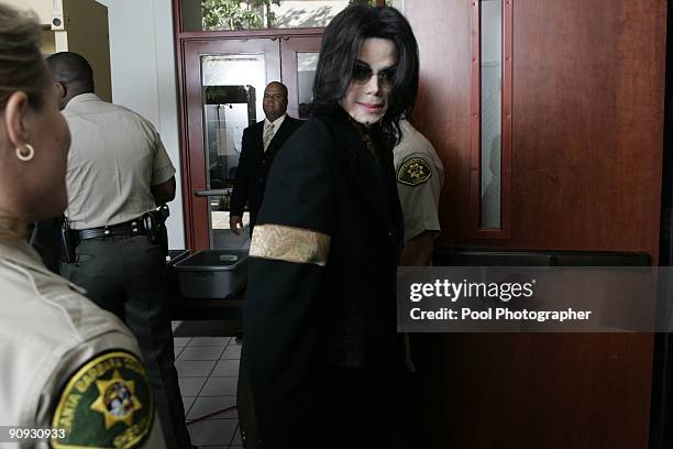 Michael Jackson enters the courtroom at the Santa Barbara County Courthouse for day 20 of his child molestation trial in Santa Maria, California...