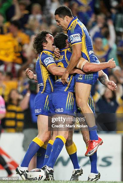 Jarryd Hayne of the Eels celebrates a try by team mate Ben Smith during the first NRL semi final match between the Parramatta Eels and the Gold Coast...