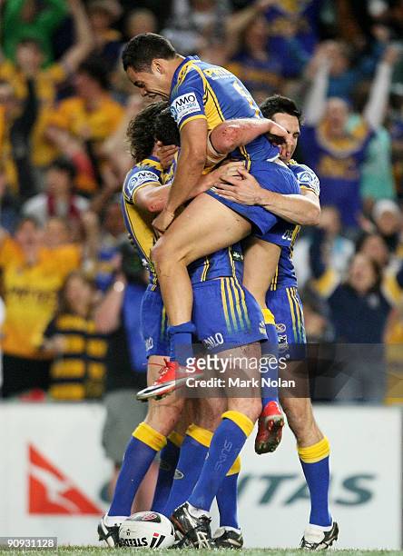 Jarryd Hayne of the Eels celebrates a try by team mate Ben Smith during the first NRL semi final match between the Parramatta Eels and the Gold Coast...