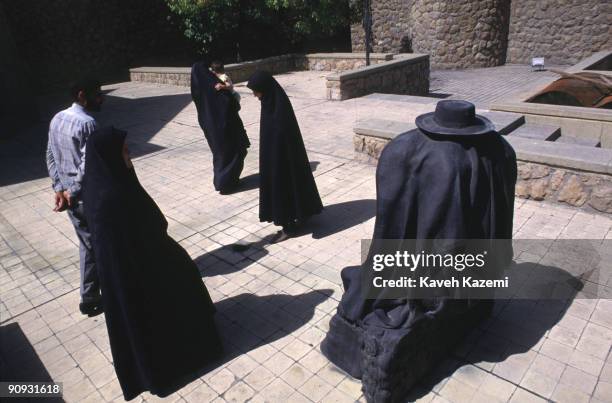 Young women in Islamic dress viewing Rene Magritte's sculpture 'The Cage' in the grounds of Tehran Museum of Contemporary Art, 23rd September 1999.