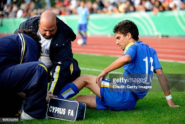 Nikos Englezou receives medical treatment during the U17 friendly international match between Germany and Cyprus at the Schlosspark stadium on...