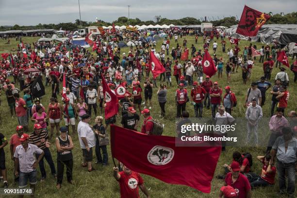 Supporters hold signs at a Brazilian Movement of Landless Rural Workers temporary campsite ahead of former President Luiz Inacio Lula da Silva's...