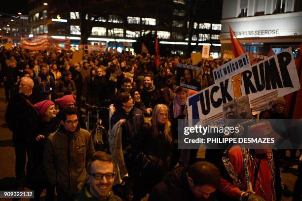 People rally as they protest against the attendance of the US president to the upcoming Davos World Economic Forum, on January 23 in central Zurich....