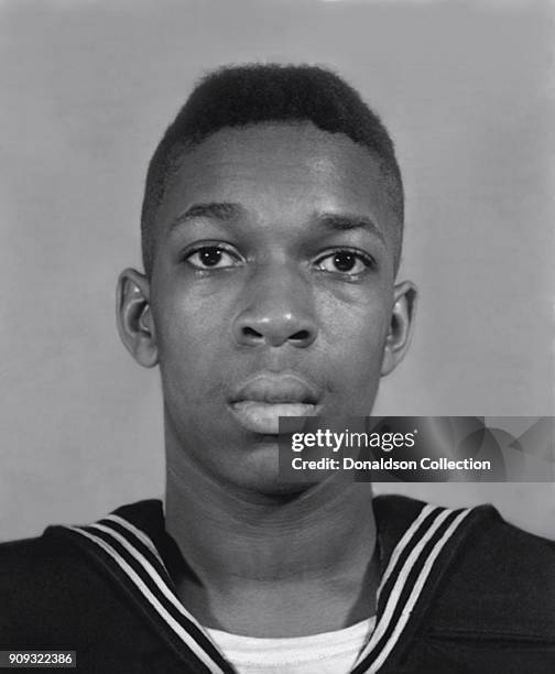 Jazz musician John Coltane poses for a Navy identity photo circa 1945.