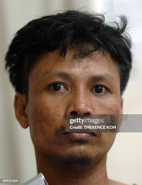 Suhudi Ocenyo Jawani, a member of a Muslim terrorist group, also known as Abu Masib and Ibno Madja sits inside a military camp in Zamboanga City on...