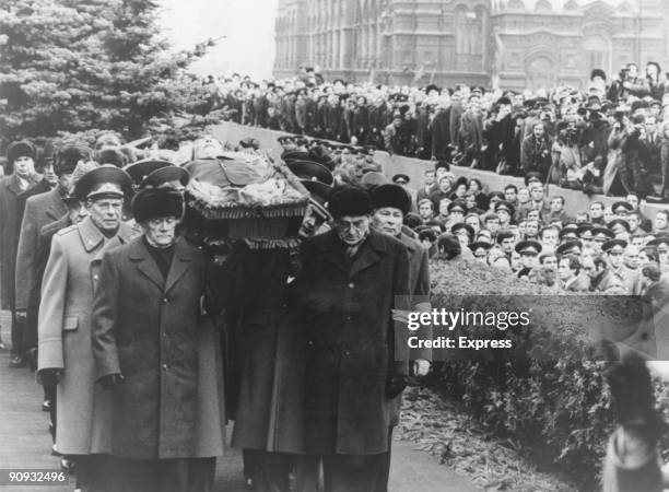 Politburo members carry the open coffin of General Secretary of the Communist Party of the Soviet Union Leonid Brezhnev to his grave in the Kremlin...