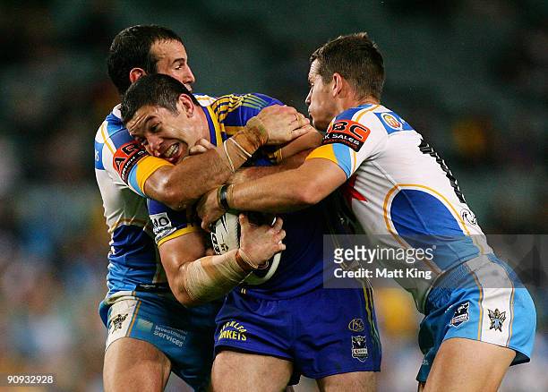 Nathan Cayless of the Eels takes on the defence during the first NRL semi final match between the Parramatta Eels and the Gold Coast Titans at the...