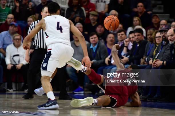 Moorman II of the Temple Owls can't save a ball from going out of bounds as Darnell Foreman of the Pennsylvania Quakers looks on during the second...