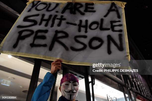 People rally as they protest against the attendance of the US president to the upcoming Davos World Economic Forum, on January 23 in central Zurich....