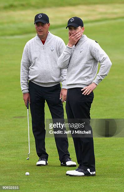 Will Barnes and Jon Bevan of the Great Britain lines up their shot on the 11th green in the morning foursome matches at The Carrick on Loch Lomond on...