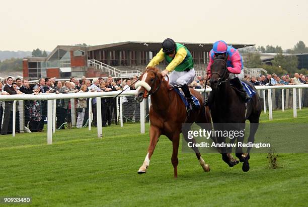 Steve Drowne rides Pastoral Player to victory from Jimmy Fortune on Locksley Hall during The Dubai Duty Free Golf World Cup E.B.F. Maiden Stakes at...