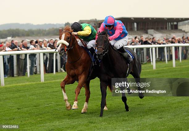 Steve Drowne rides Pastoral Player to victory from Jimmy Fortune on Locksley Hall during The Dubai Duty Free Golf World Cup E.B.F. Maiden Stakes at...