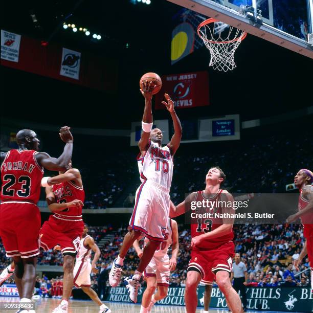 Sam Cassell of the New Jersey Nets shoots during a game played on March 14, 1997 at Continental Airlines Arena in East Rutherford, New Jersey. NOTE...